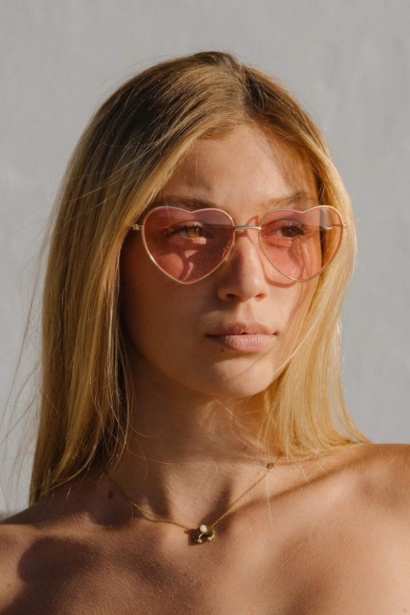 Heart-shaped sunglasses with pink lenses