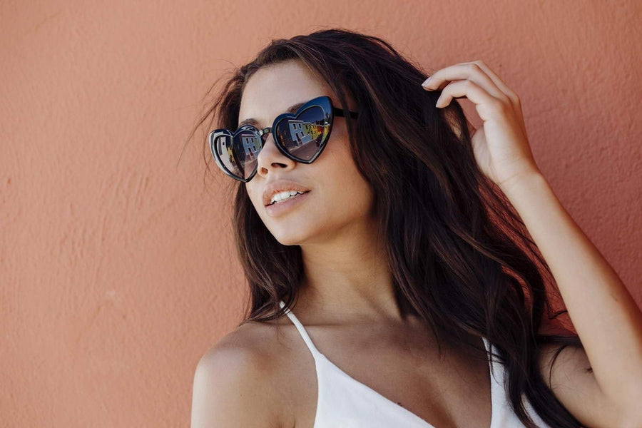 Heart-shaped sunglasses with pink lenses