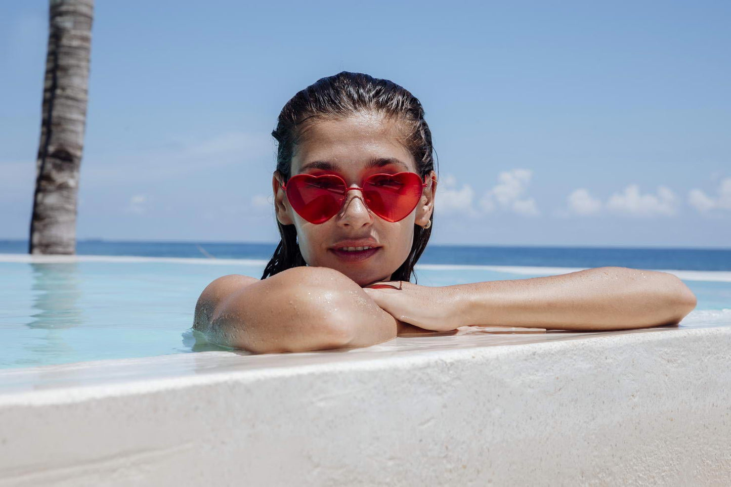 Heart-shaped sunglasses with pink lenses