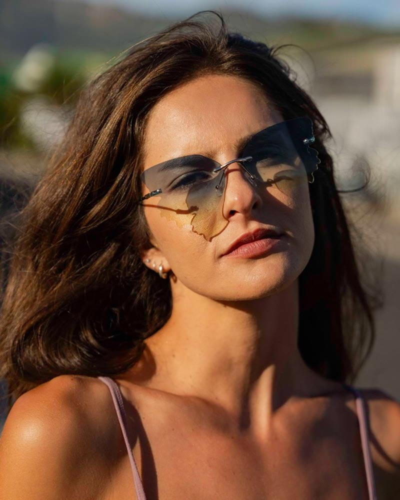 Fjärilsformade solglasögon utan ram med gradienta glas