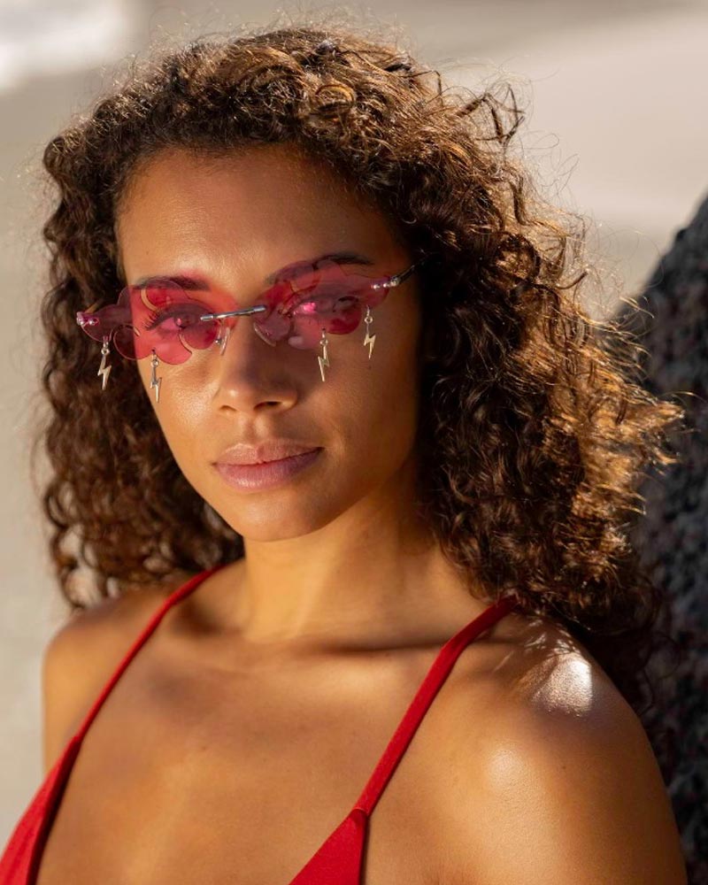 Heart-shaped sunglasses with pink lenses