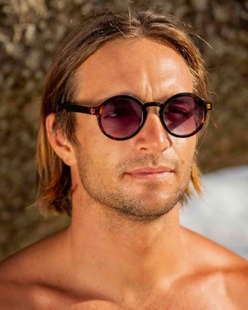 Runda solglasögon i svartbrunt med svartlila glas